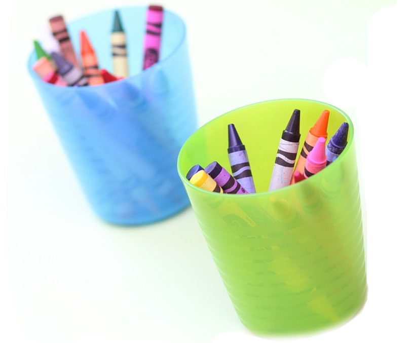 Light green and light blue cups with crayons